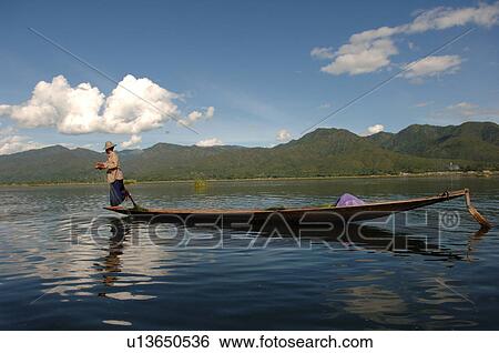 Stock Photograph - Fisherman leg rowing. Fotosearch