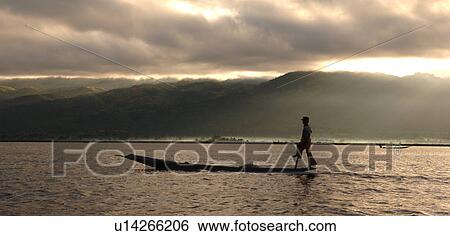 Stock Photograph - Fisherman leg rowing. Fotosearch
