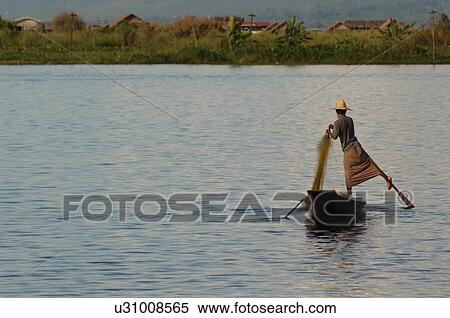 Fisherman leg rowing View Large Photo Image Stock Photography - Fisherman leg rowing. Fotosearch