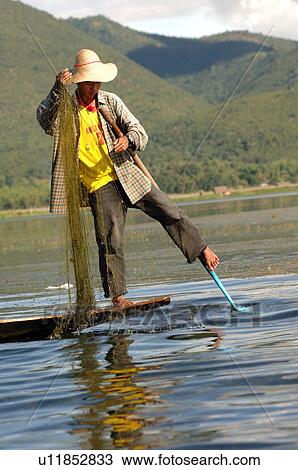 Fisherman with fishing net View Large Photo Image Stock Image - Fisherman with fishing net. Fotosearch