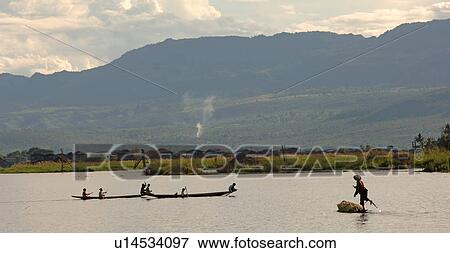 Fishermen leg rowing View Large Photo Image Stock Photo - Fishermen leg rowing. Fotosearch
