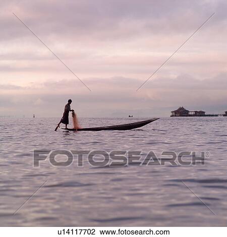 Intha fisherman in his flat-bottomed boat View Large Photo Image Stock Image - Intha fisherman in his flat-bottomed boat. Fotosearch