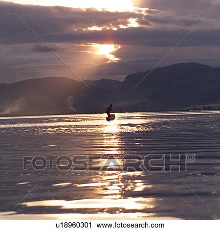 Intha fisherman in his flat-bottomed boat View Large Photo Image Stock Image - Intha fisherman in his flat-bottomed boat. Fotosearch