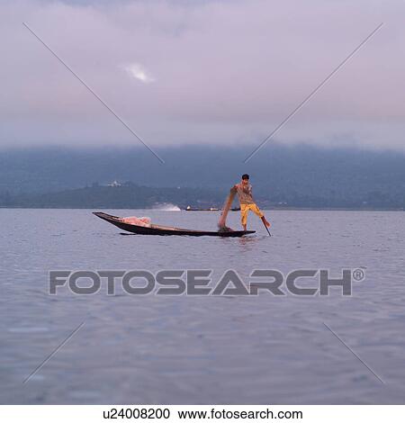 Intha fisherman in his flat-bottomed boat View Large Photo Image Stock Image - Intha fisherman in his flat-bottomed boat. Fotosearch