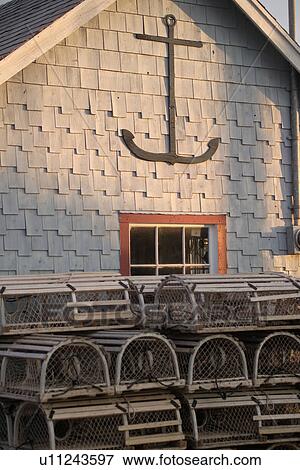 Lobster traps stacked outside an establishment View Large Photo Image Stock Photo - Lobster traps stacked outside an establishment. Fotosearch