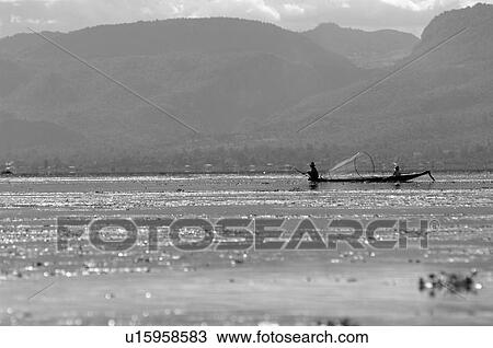Stock Image - Row boat in the distance. Fotosearch