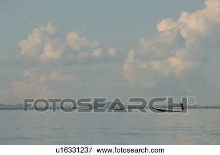 Row boat in the distance View Large Photo Image Stock Photo - Row boat in the distance. Fotosearch