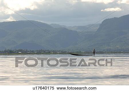 Row boat in the distance View Large Photo Image Stock Photography - Row boat in the distance. Fotosearch