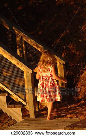 5 year old approaching wooden staircase View Large Photo Image Stock Image - 5 year old approaching wooden staircase. Fotosearch