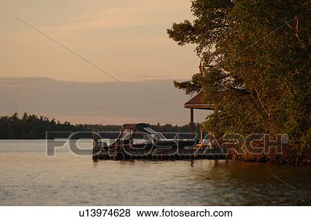Boat docked at Lake of the Woods View Large Photo Image Stock Photo - Boat docked at Lake of the Woods. Fotosearch