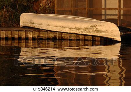 Canoe upside down on dock View Large Photo Image Picture - Canoe upside down on dock. Fotosearch