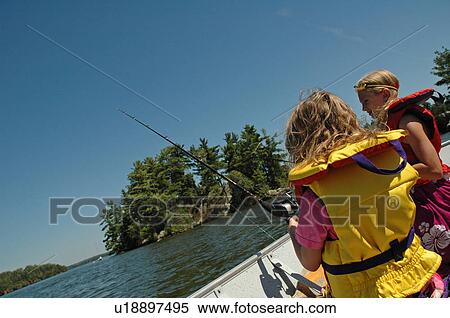 Children in a boat fishing View Large Photo Image Stock Photography - Children in a boat fishing. Fotosearch