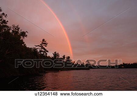 Crimson sunset over Lake of the Woods View Large Photo Image Stock Photo - Crimson sunset over Lake of the Woods. Fotosearch