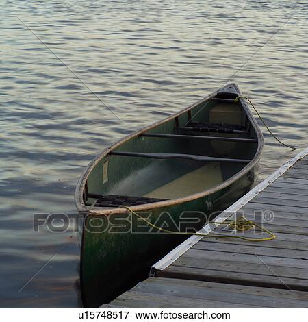 Empty canoe at edge of dock View Large Photo Image Stock Photo - Empty canoe at edge of dock. Fotosearch