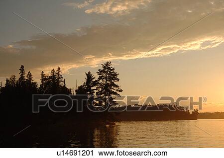 Stock Image - Lake of the Woods at twilight. Fotosearch
