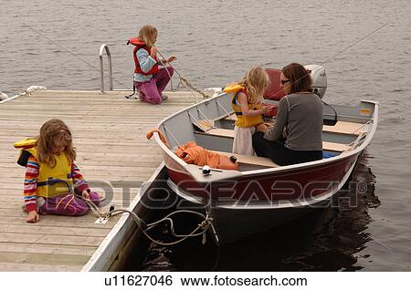 Mother and children getting ready to board a boat View Large Photo Image Stock Photograph - Mother and children getting ready to board a boat. Fotosearch