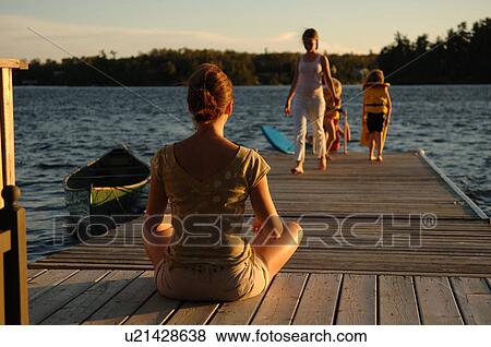 People on a dock at twilight View Large Photo Image Stock Photo - People on a dock at twilight. Fotosearch
