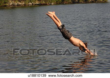 Teenage boy diving into the lake View Large Photo Image Stock Photo - Teenage boy diving into the lake. Fotosearch