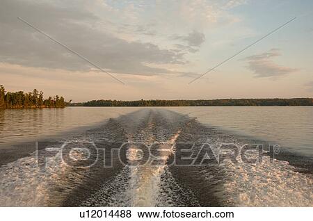 Trail in water after boat View Large Photo Image Stock Photo - Trail in water after boat. Fotosearch