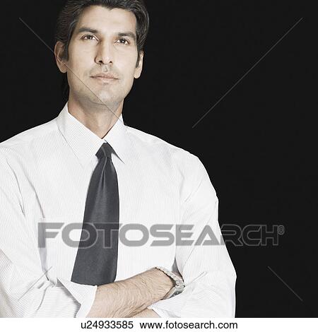 Close-up of a businessman thinking View Large Photo Image Stock Photography - Close-up of a businessman thinking. Fotosearch