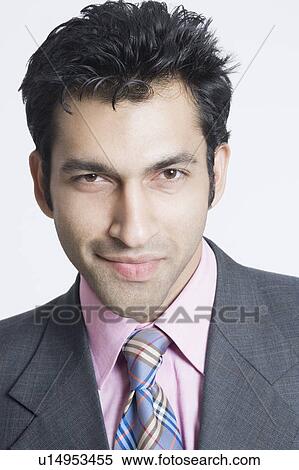 Stock Photography - Portrait of a businessman smiling. Fotosearch