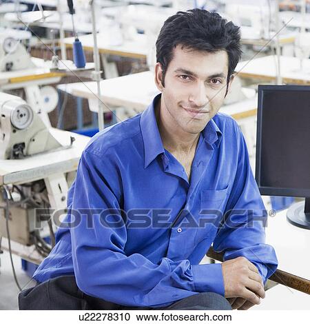 Portrait of a male fashion designer sitting in a textile industry View Large Photo Image Stock Image - Portrait of a male fashion designer sitting in a textile industry. Fotosearch