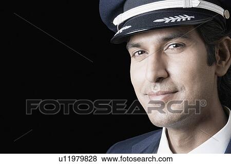 Portrait of a pilot smiling View Large Photo Image Stock Photo - Portrait of a pilot smiling. Fotosearch