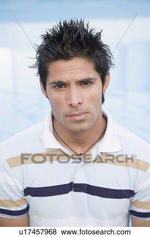 Portrait of a young man looking serious View Large Photo Image Stock Photo - Portrait of a young man looking serious. Fotosearch