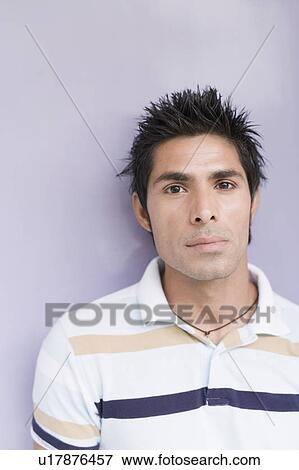 Portrait of a young man looking serious View Large Photo Image Stock Photo - Portrait of a young man looking serious. Fotosearch