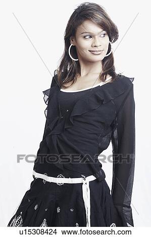 Close-up of a young woman smiling View Large Photo Image Picture - Close-up of a young woman smiling. Fotosearch