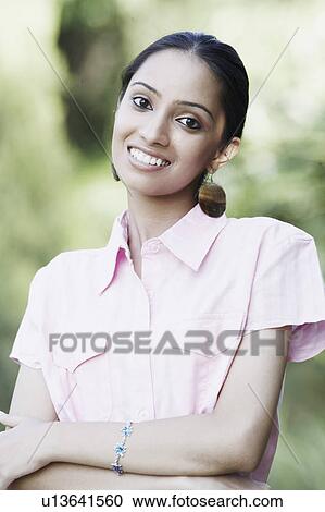 Portrait of a teenage girl smiling View Large Photo Image Stock Image - Portrait of a teenage girl smiling. Fotosearch