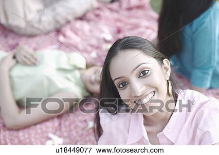 Stock Photo - Portrait of a teenage girl smiling. Fotosearch