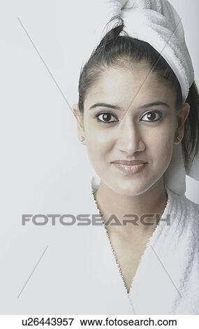 Portrait of a young woman in a bathrobe View Large Photo Image Stock Photo - Portrait of a young woman in a bathrobe. Fotosearch