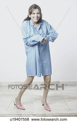 Portrait of a young woman smiling View Large Photo Image Stock Photo - Portrait of a young woman smiling. Fotosearch