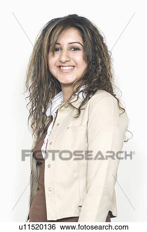 Stock Photograph - Portrait of a young woman smiling. Fotosearch