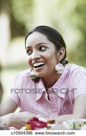 Stock Photograph - Close-up of a teenage girl smiling. Fotosearch