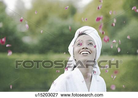 Stock Photo - Close-up of a teenage girl with a towel wrapped around her head. Fotosearch