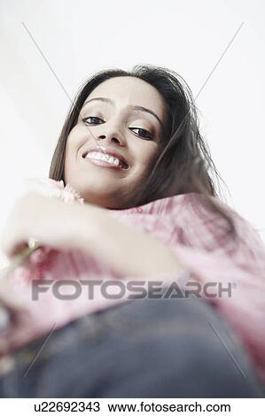 Portrait of a teenage girl smiling View Large Photo Image Stock Image - Portrait of a teenage girl smiling. Fotosearch