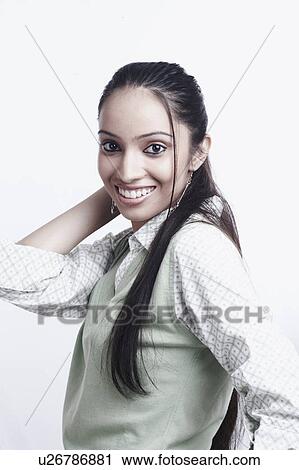Stock Image - Portrait of a teenage girl smiling. Fotosearch