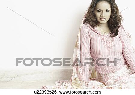 Portrait of a young woman smiling View Large Photo Image Stock Photograph - Portrait of a young woman smiling. Fotosearch