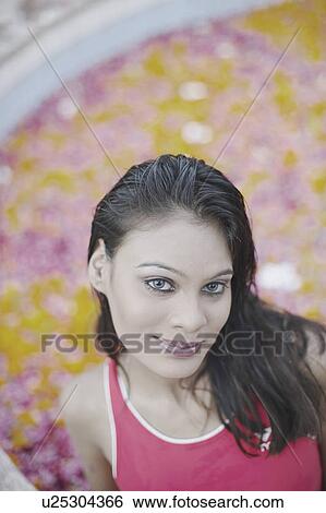 Portrait of a young woman smiling View Large Photo Image Stock Photograph - Portrait of a young woman smiling. Fotosearch
