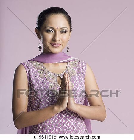 Portrait of a mid adult woman in salwar kameez with her folded hands View Large Photo Image Stock Photography - Portrait of a mid adult woman in salwar kameez with her folded hands. Fotosearch