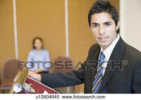Stock Photography - Portrait of a businessman giving a speech. Fotosearch