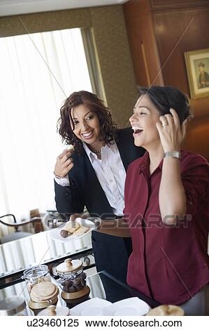 Two businesswomen smiling View Large Photo Image Stock Photography - Two businesswomen smiling. Fotosearch