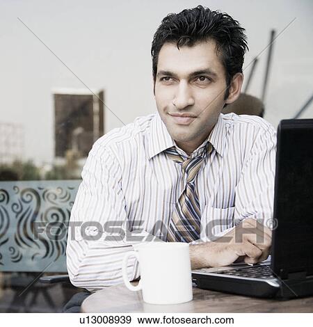 Stock Photo - Close-up of a businessman sitting in a restaurant. Fotosearch