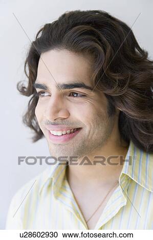 Close-up of a young man smiling View Large Photo Image Stock Image - Close-up of a young man smiling. Fotosearch