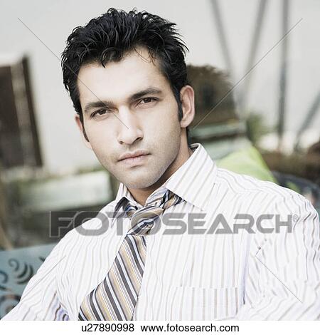 Stock Photo - Portrait of a businessman in a restaurant. Fotosearch