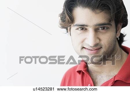 Stock Image - Portrait of a young man smiling. Fotosearch