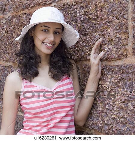 Portrait of a young woman smiling, Goa, India View Large Photo Image Stock Image - Portrait of a young woman smiling, Goa, India. Fotosearch