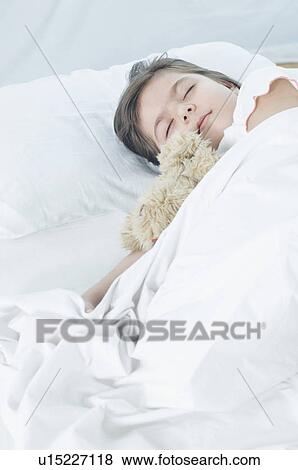 Girl sleeping on the bed View Large Photo Image Stock Photo - Girl sleeping on the bed. Fotosearch